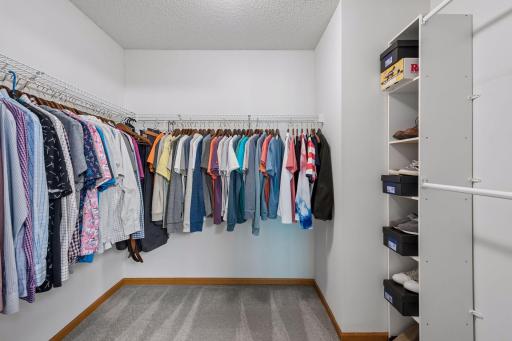 Primary walk-in closet is spacious with lots of options.