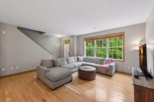 Photo for 11025 Oak Grove Circle, C, Woodbury, MN 55129 - listing #7112289 Spacious family room has gorgeous engineered hardwood floors. Neutral colors make this home move-in ready.