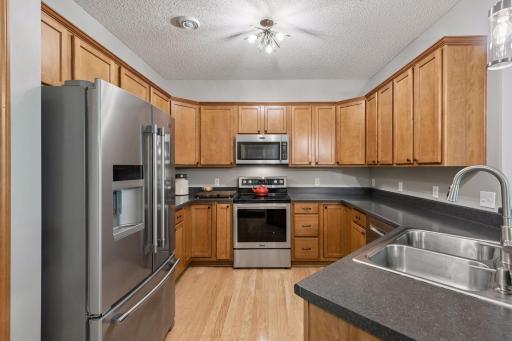 Awesome cook's kitchen with a ton of counter space, fantastic appliances and beautiful cabinets, which includes a pantry. The modern lighting is amazing throughout.