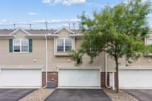 The tree offers shade for bedroom 3. The AC unit was new in 2022. It's so big, the little white privacy fence had to be removed to make room for it.