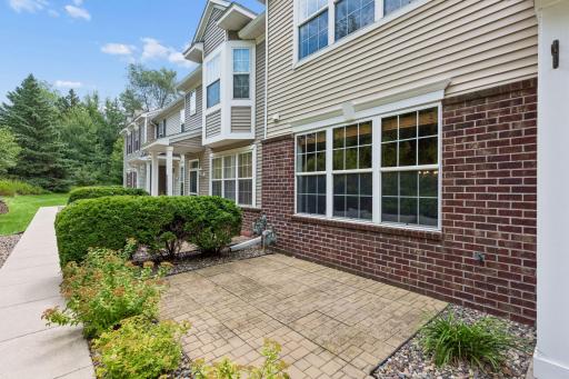 Front patio is private and looks out at the greenery.