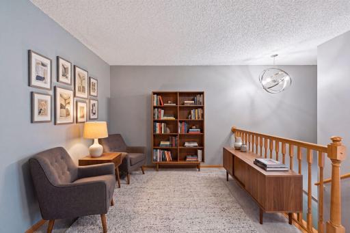 AI Staged Loft. This space could also be an office or TV area.