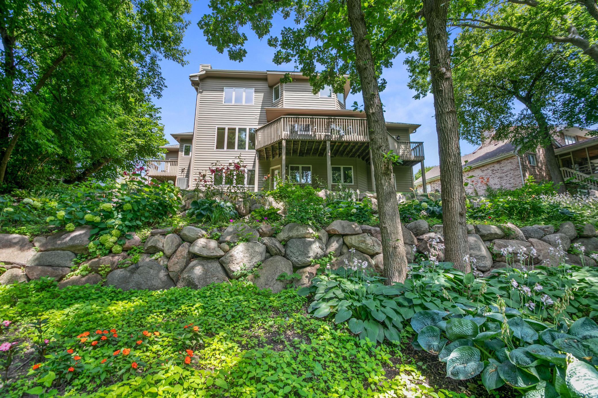 Rear of home and boulder wall