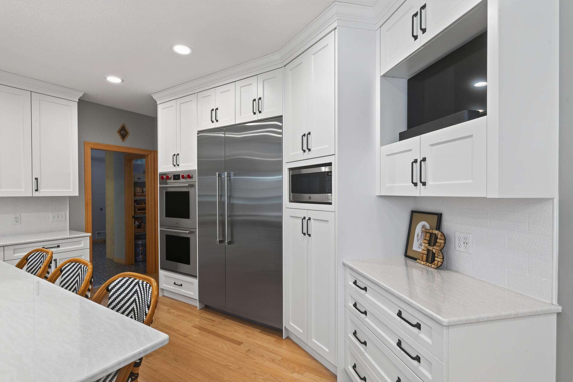 From the statement Sub-Zero refrigerator to the double ovens and dedicated coffee bar, every detail of this kitchen was chosen with intention and designed for those who demand the very best.