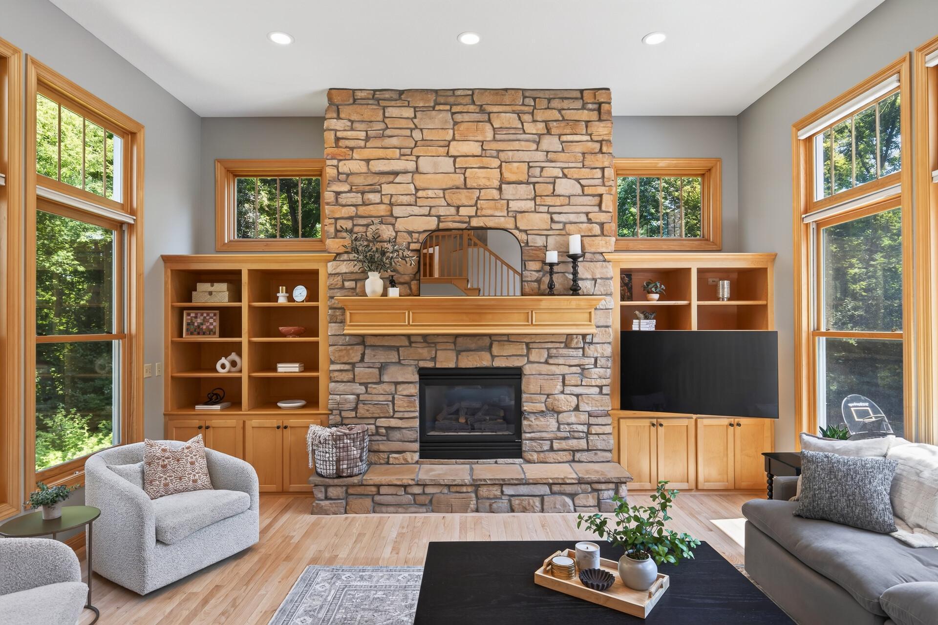 Custom gas fireplace with stone surround and beautiful built-ins for every cozy day this winter.