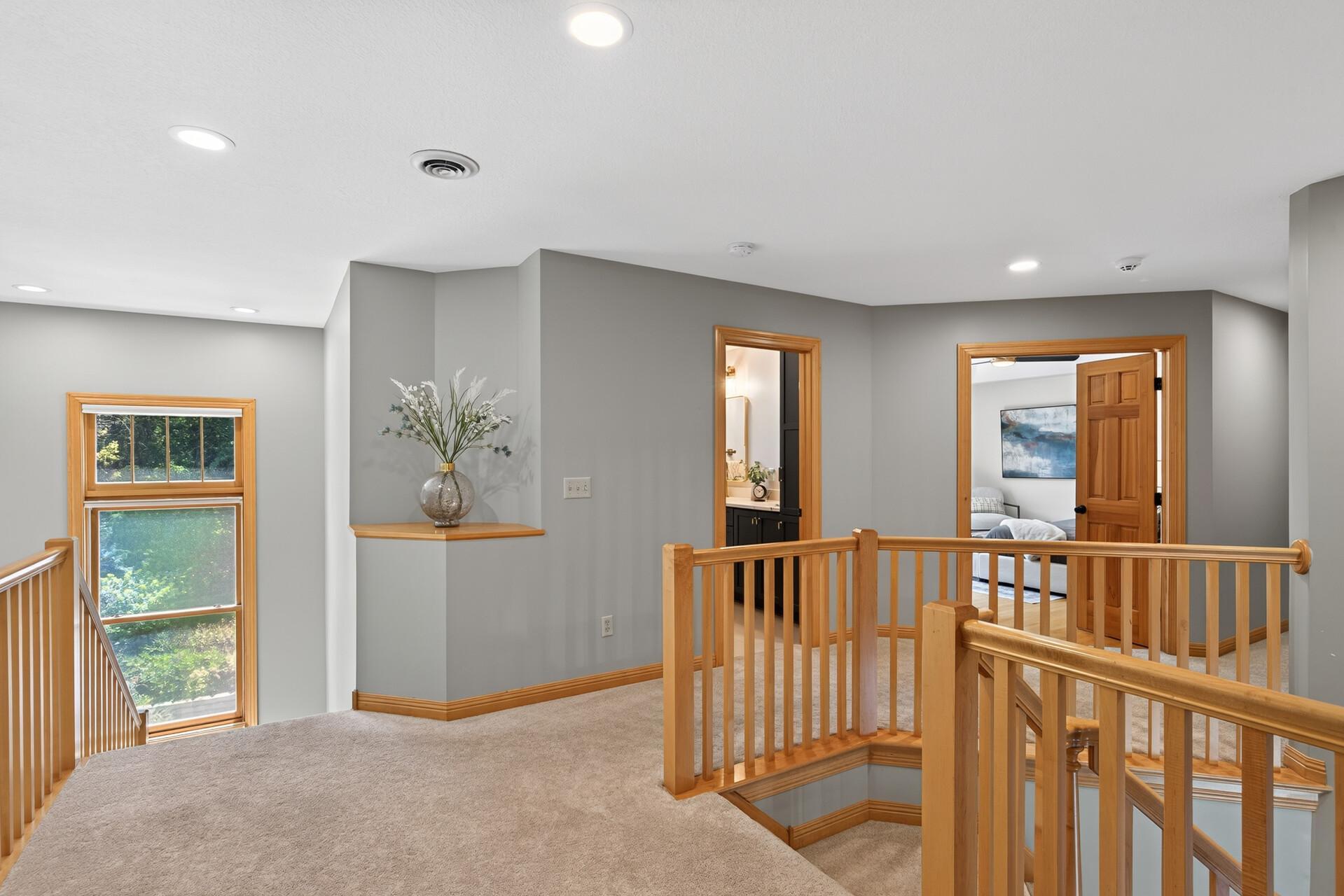 Double entry upper landing offers seamless access to both the front and back of the home, a grand, thoughtfully designed detail that elevates the flow and feel of this entire upper level.
