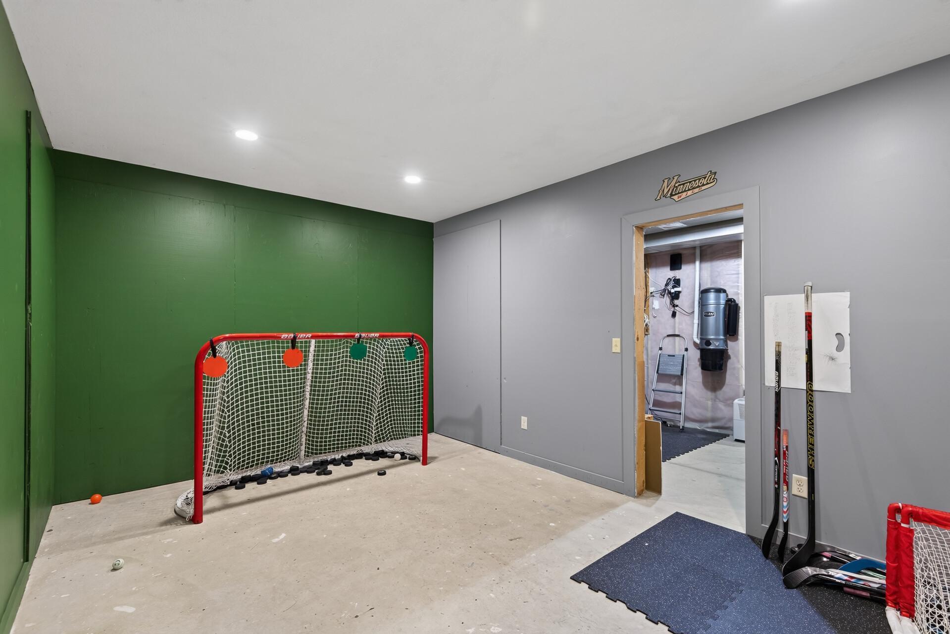 Get ready for hockey season in this Wild Inspired hockey room! This space is made for shooting and has been freshly painted!