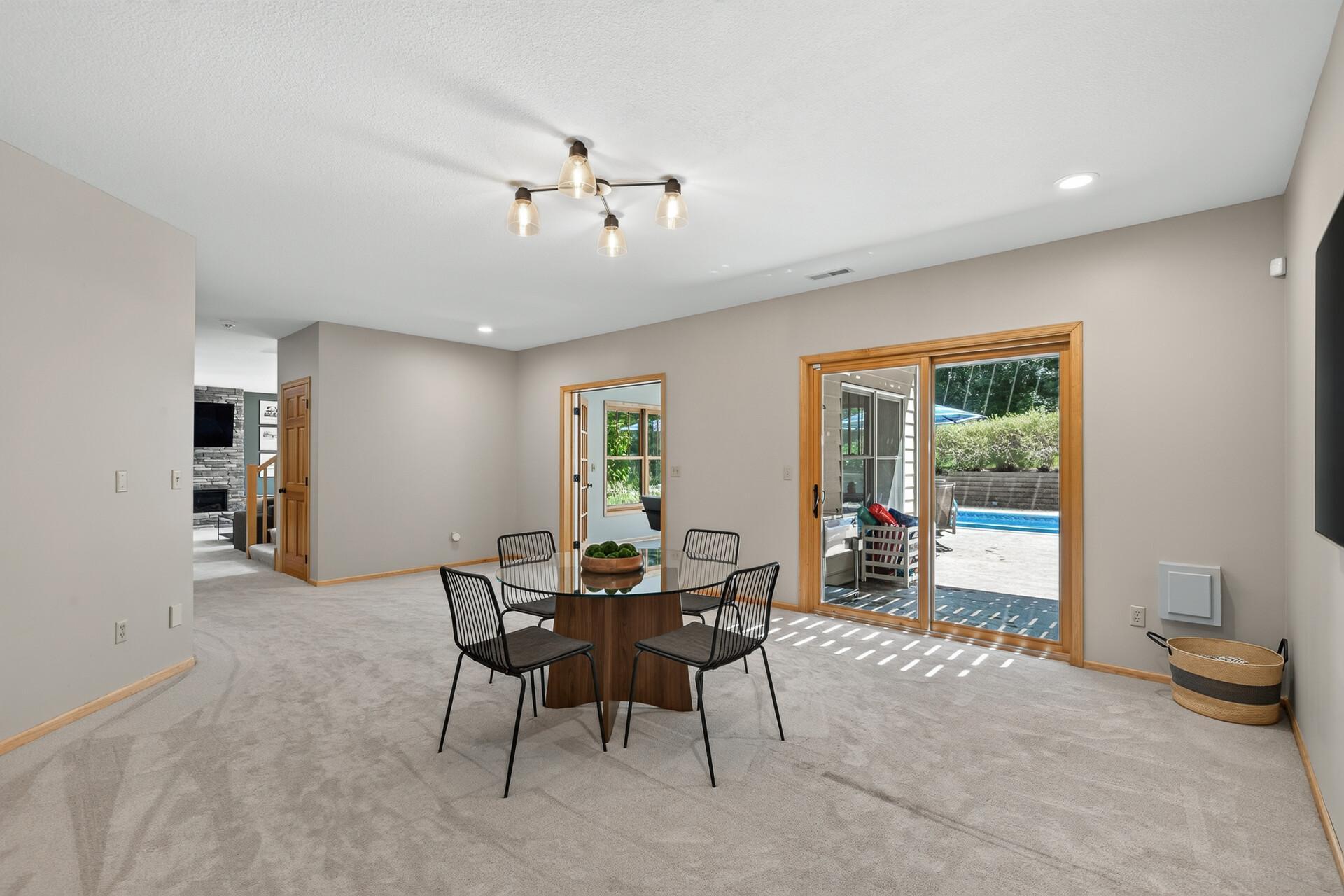 Pool table? Air hockey? Game table? Yes, yes, and yes; this open entertaining space has room for it all and then some. Plus space for a future bar!
