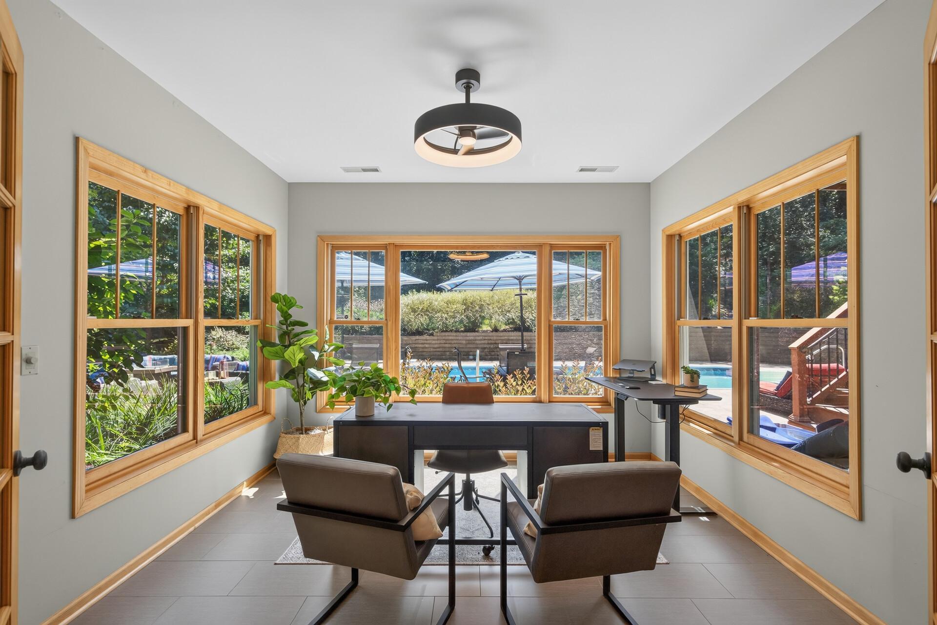 Whether it is a 2nd home office, a creative studio, a reading room, or a quiet retreat; this window-wrapped lower-level space adapts effortlessly to whatever your life needs most right now.