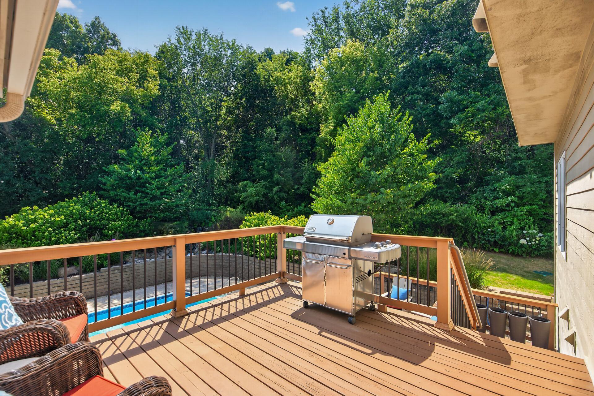 Step right out of the sunroom onto this beautifully situated deck; perfectly positioned off the kitchen for effortless summer grilling, al fresco dining, and everything that makes a warm Minnesota evening worth savoring.