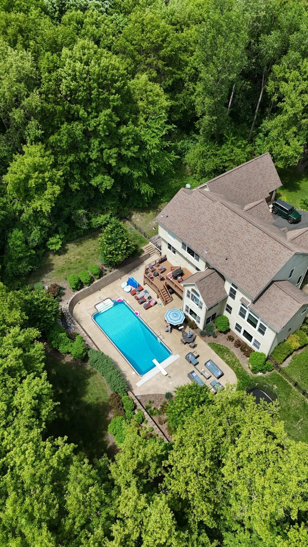 This stunning aerial view captures everything that makes this 3-acre estate so extraordinary; close enough to town for every convenience yet private enough to feel like your own piece of the country. The best of both worlds, perfectly balanced.