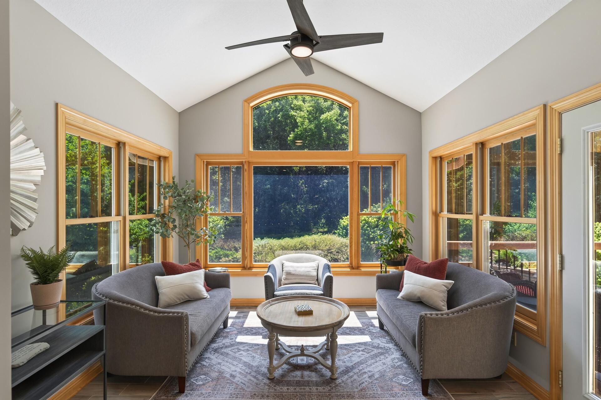 This sun-drenched sunroom with walls of windows overlooking the resort-style backyard is a year-round treasure; cool summer mornings with a coffee in hand and cozy winter afternoons watching the snow fall over your private estate.