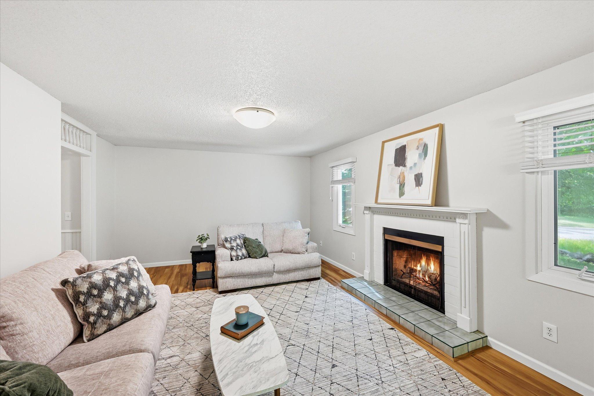 Living room with wood burning fireplace