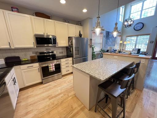9' ceilings in kitchen and hardwood flooring.
