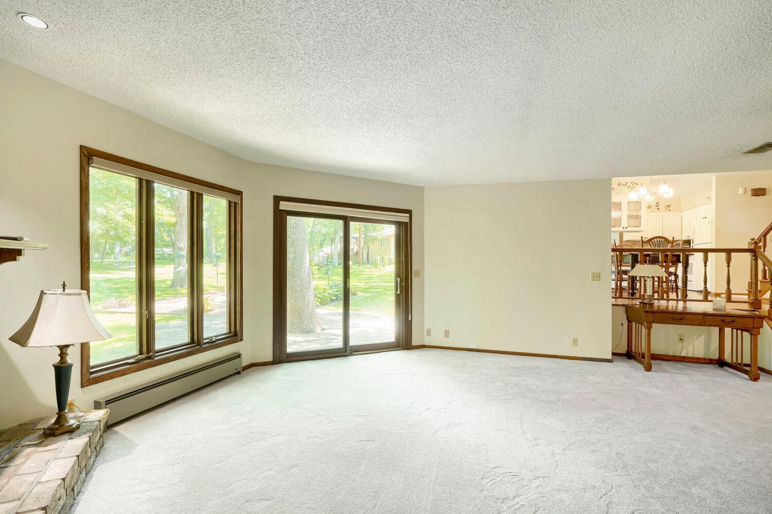 Living room with sliding door to walkout.