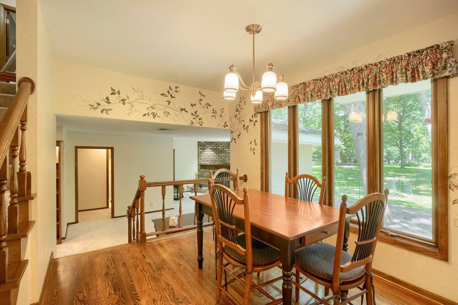 Informal dining off kitchen with beautiful hardwood floor.