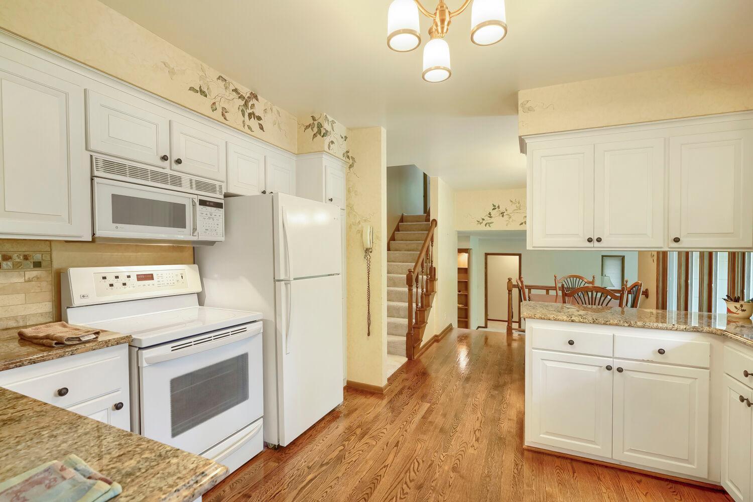 Another great view of the kitchen showing the beautiful floors.