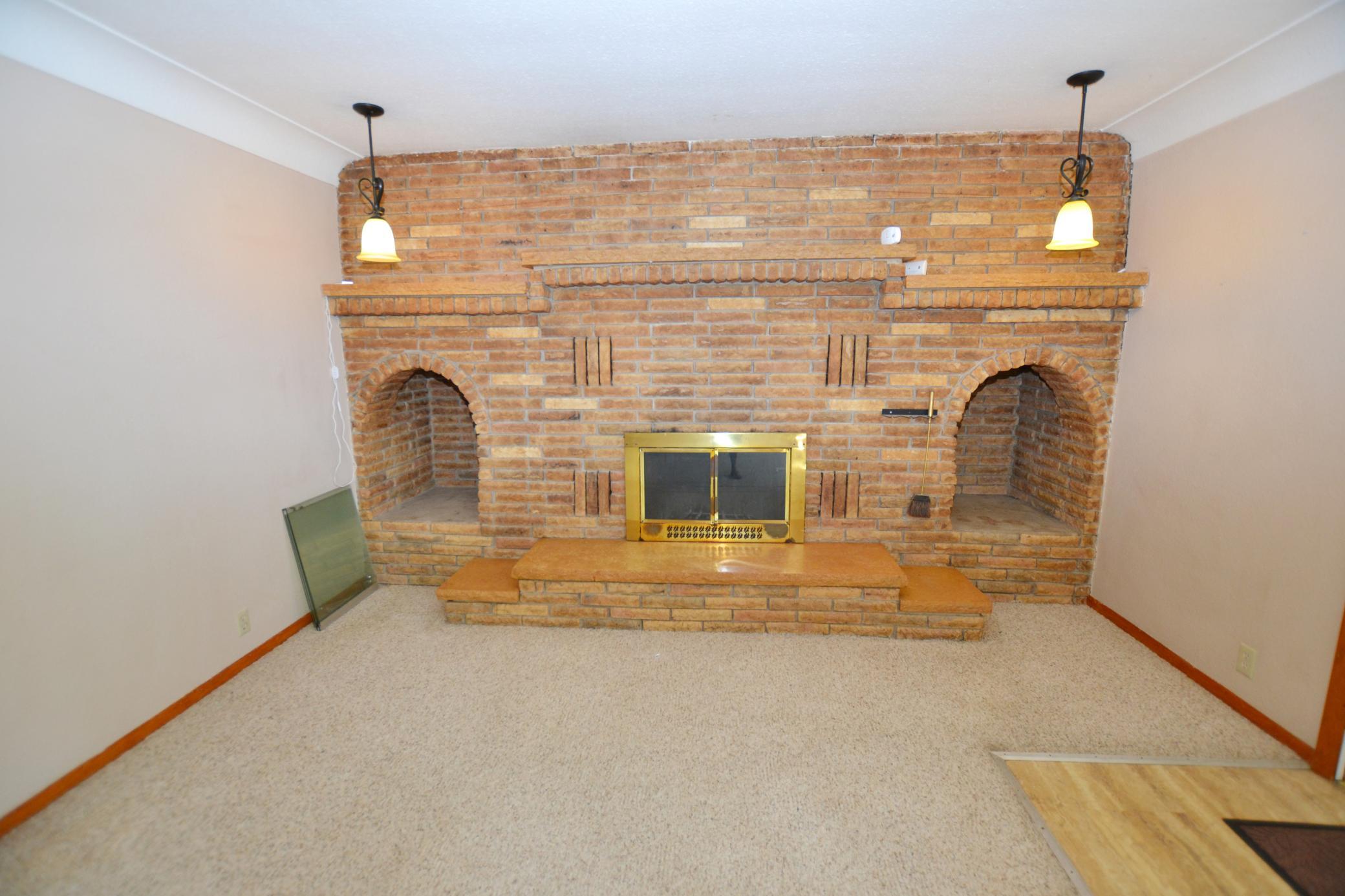Classic, stunning brick fireplace.
