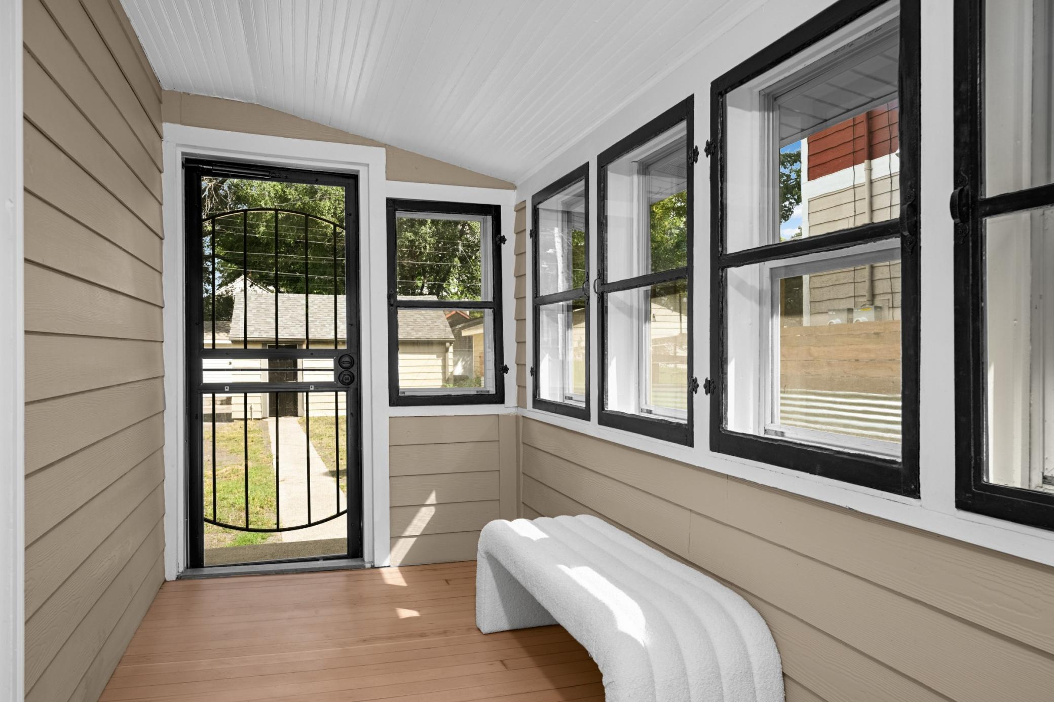 Beautifully refinished hardwood flooring in the porch