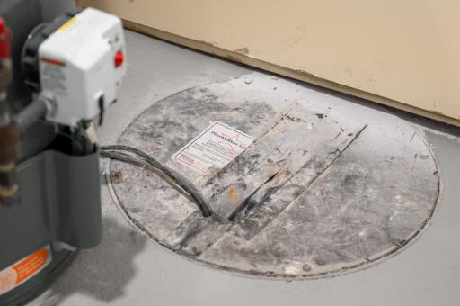 Brand new drain tile through foundation perimeter with sump basket and sump pump (discharge pipe hidden in the wall)