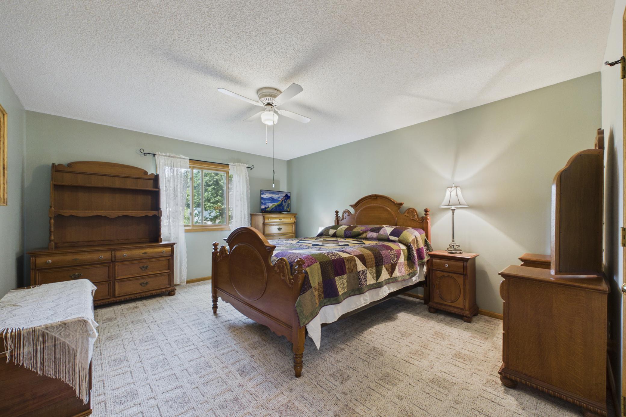 Primary bedroom with walk in closet on upper level