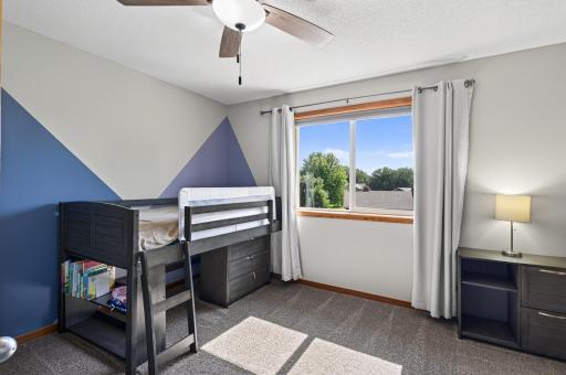 Third upper level bedroom with walk in closet