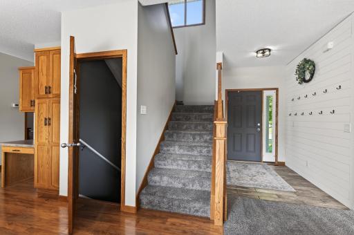 Open and airy staircase with oversized window.