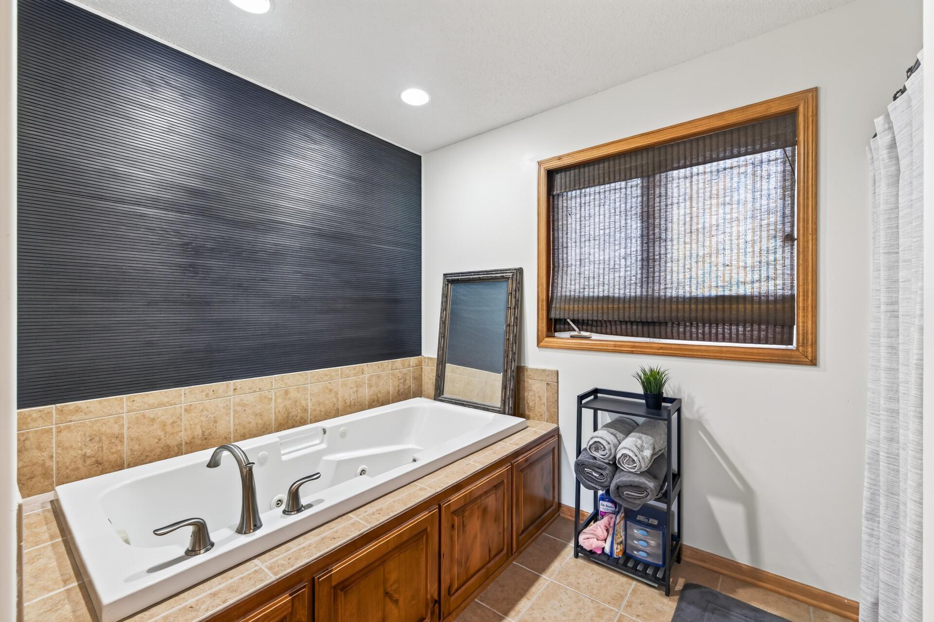 Updated primary bathroom with separate tub/shower