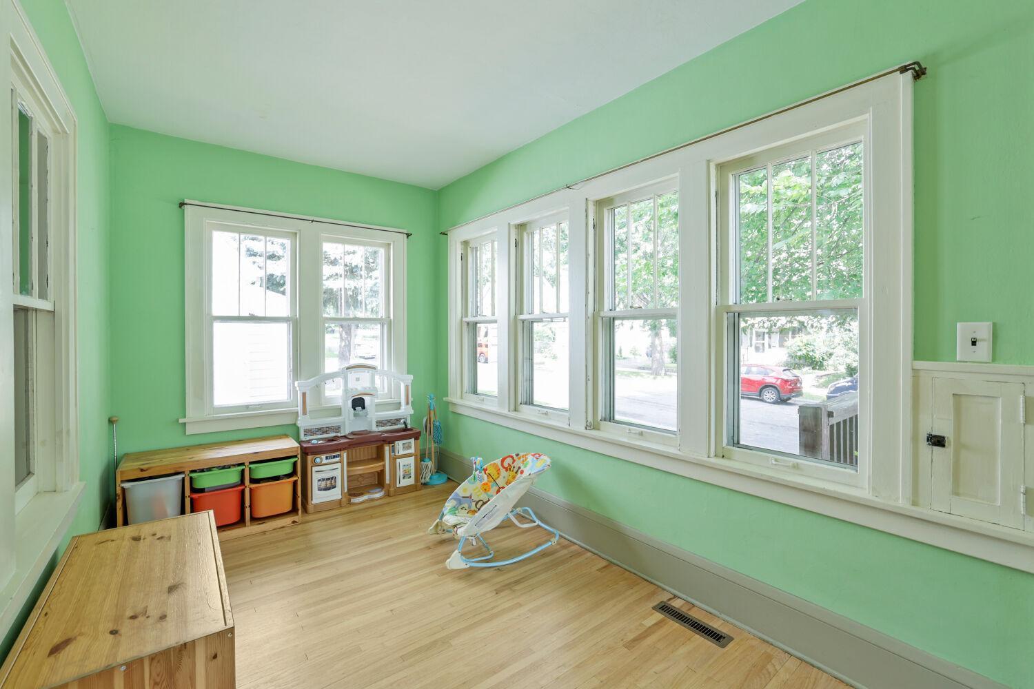 Bright and sunny enclosed front porch!