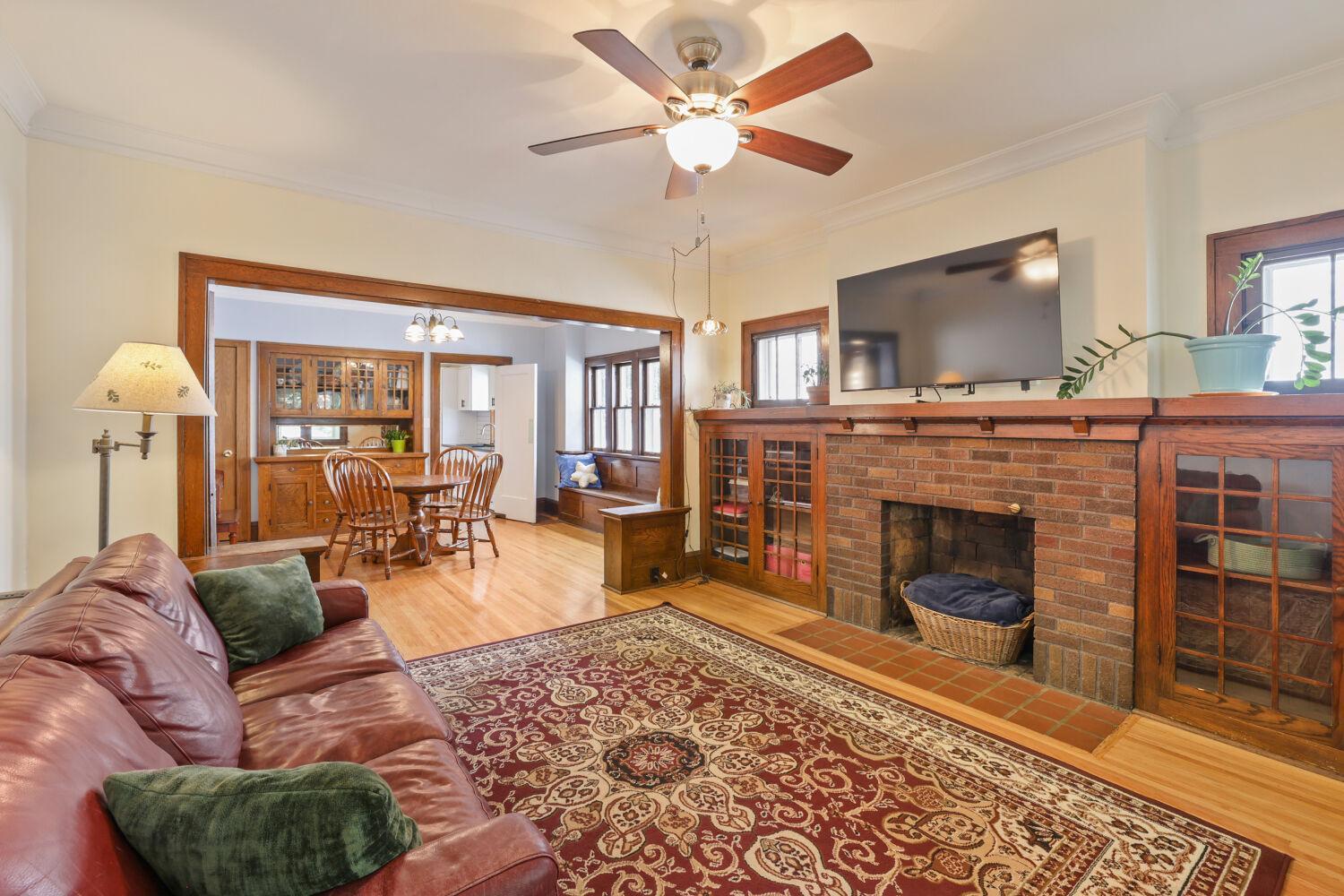 Large living room with fireplace and built-in cabinets!
