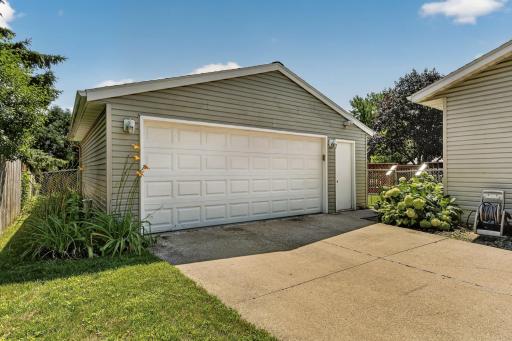 Oversized 2 car garage with room for a workspace.
