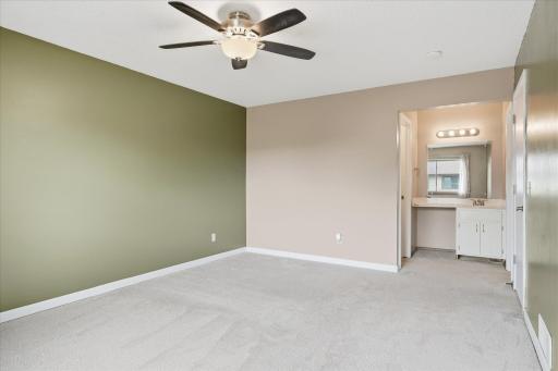 Primary bedroom has its own separate vanity & sink area, plus access to the main bathroom.