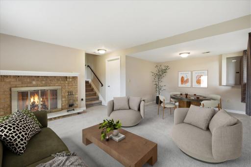 Virtually staged lower level family room.