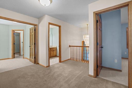 Balcony overlooking the entryway light fixture.