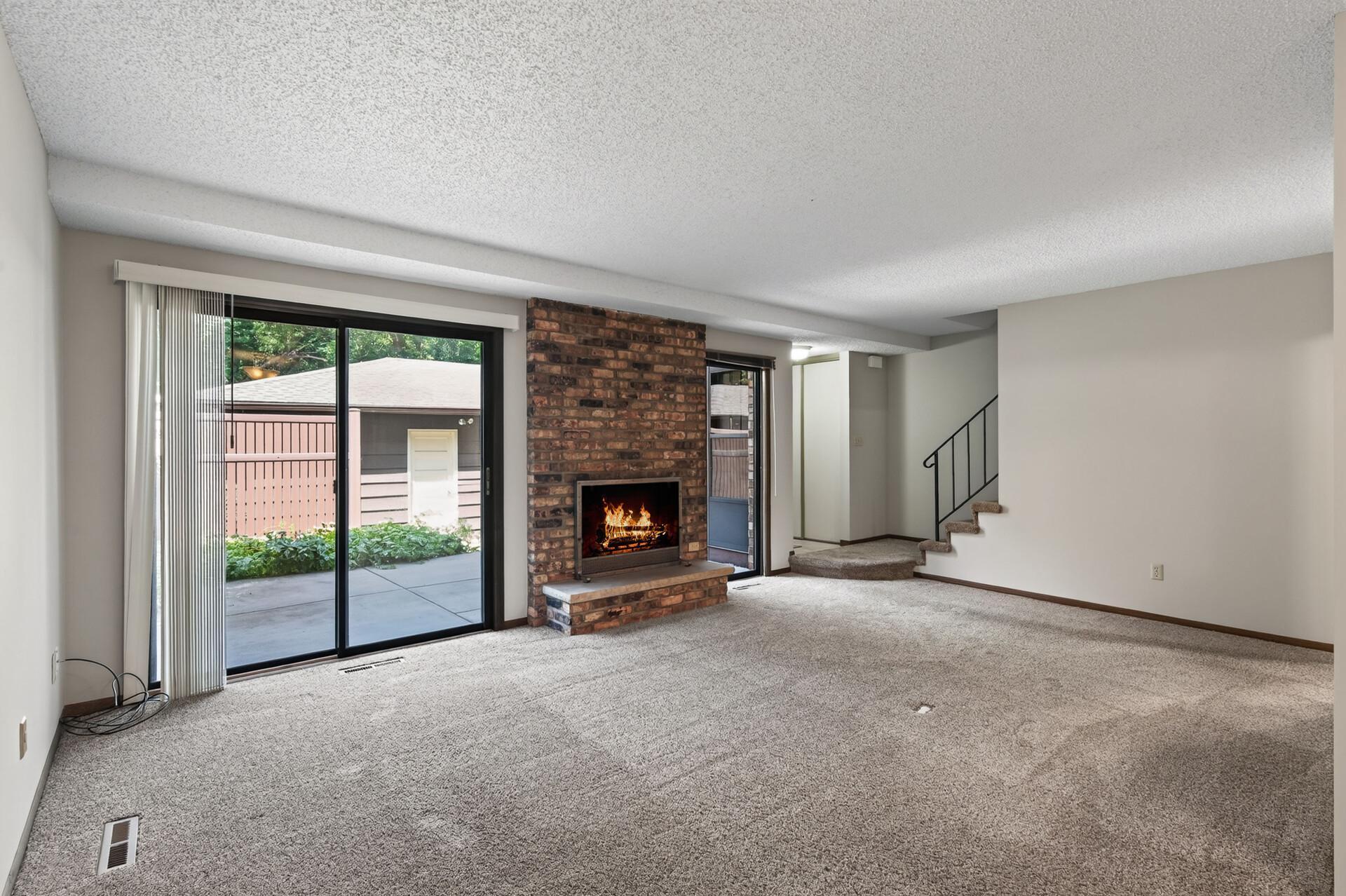 Wood burning fire place with sliding door that walks out to large private patio.