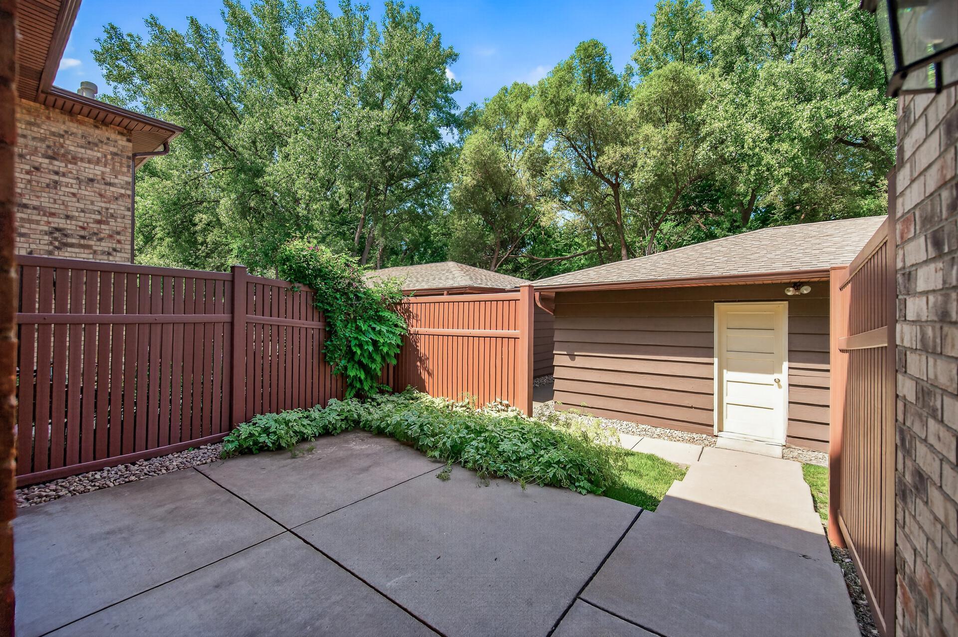 Patio walks out to large 2 car garage.