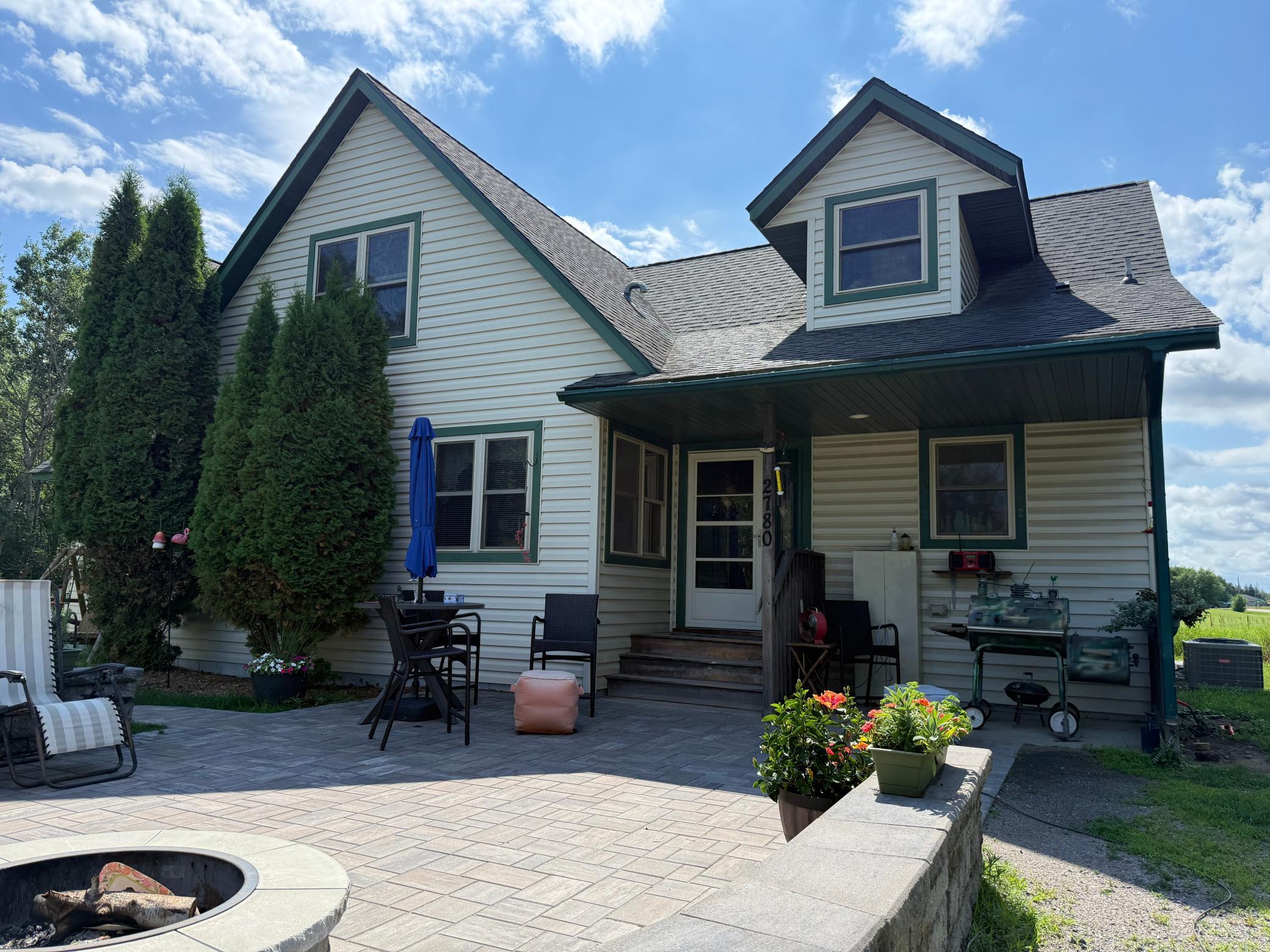 Back entrance of home with a beautiful paver patio!