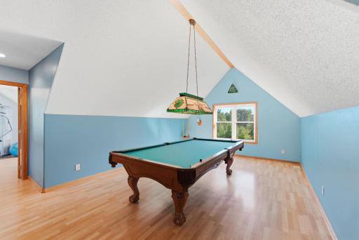 The loft has been used as a billiard area.