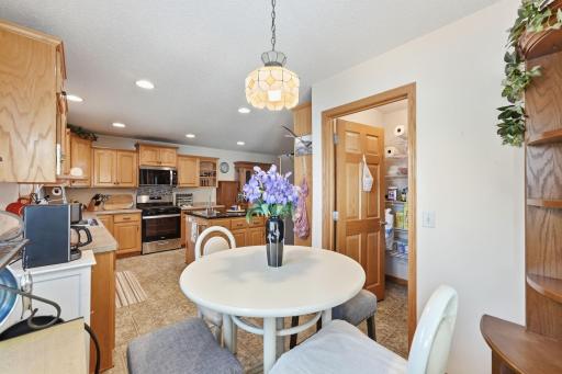 A large walk-in pantry is conveniently located off this nook.