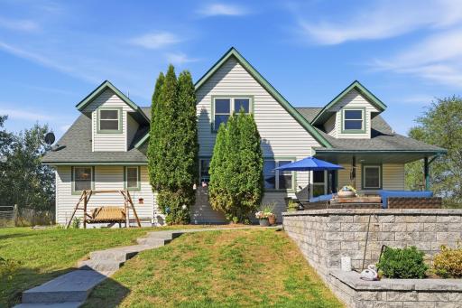 Paver patio by back entrance is accessible from driveway.