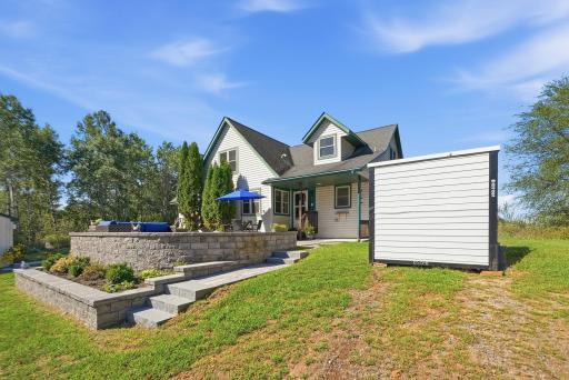 Granite stairs and pavers descend from patio on both sides.