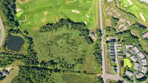 15-1/2 acres of land! Aerial view--home is in upper right corner by golf course.