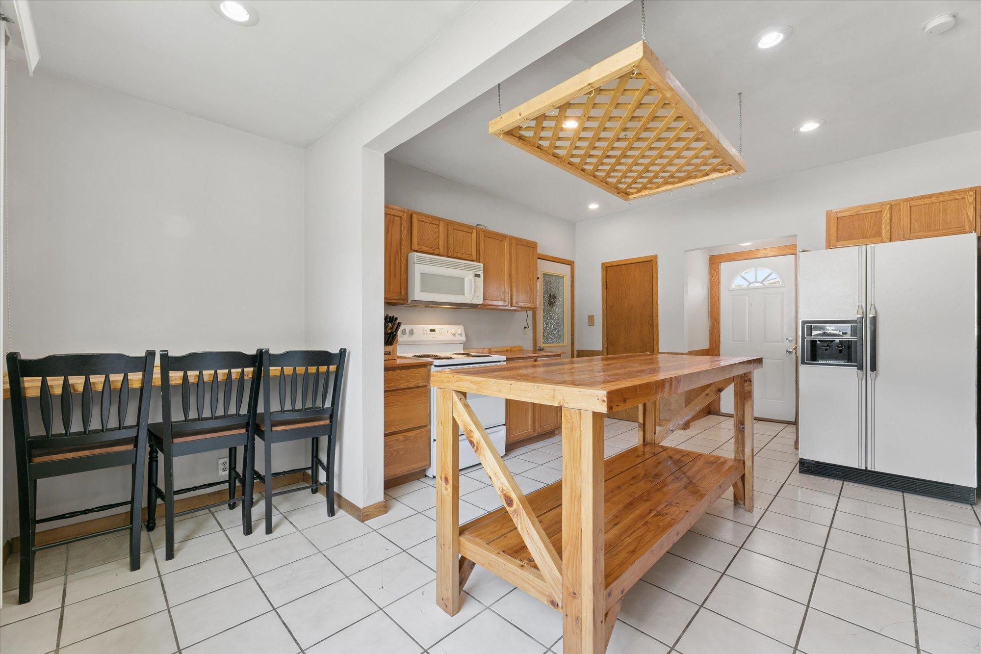 Eat in kitchen island or a great area for a home office desk
