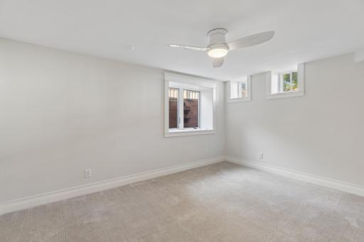 Lower-level bedroom offering a private and comfortable space for guests, family, or flexible use.
