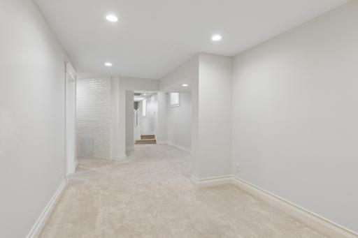 Versatile recreation room with plenty of room for gathering and everyday use.