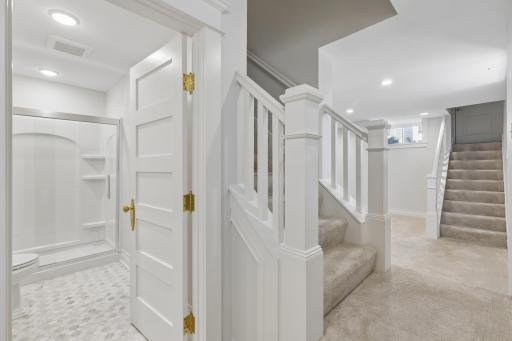 Lower-level landing provides a welcoming transition to the additional living spaces.