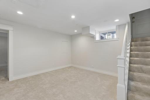 Family room with walkout stairs providing easy access to the backyard.