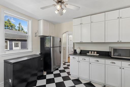 Large mudroom off the back door offers flexible space for storage and everyday use.