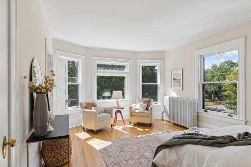 Bay windows add character and natural light to the primary bedroom.