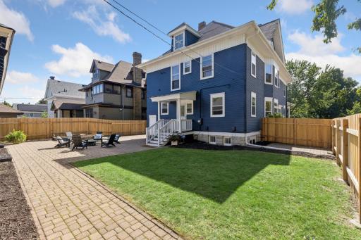Flat backyard with plenty of open space for outdoor activities, entertaining, or relaxing.